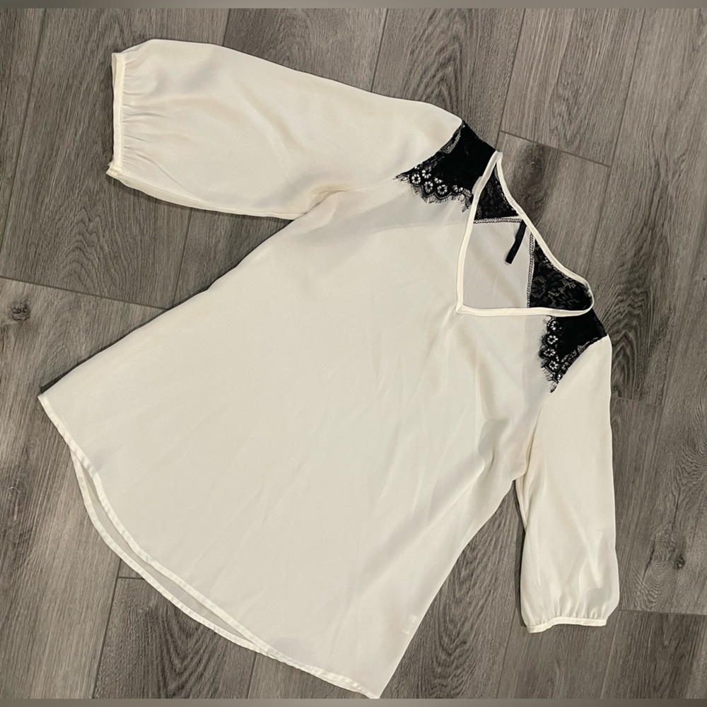 White blouse with black lace detail